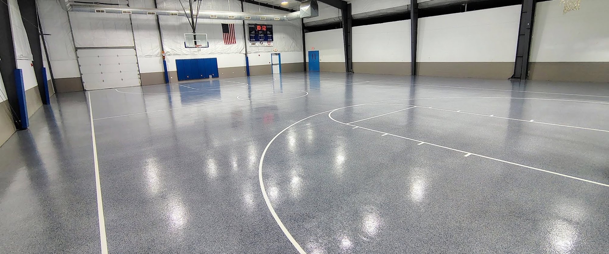 Gray flake epoxy gym floor with court lines